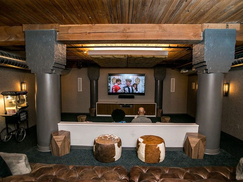 a man sitting on a couch in front of a tv
