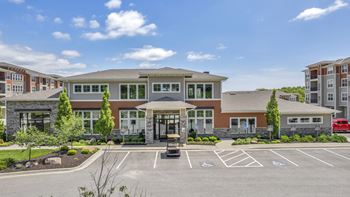 Clubhouse parking lot with golf cart