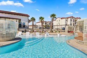 the swimming pool at the preserve at polo towers apartments