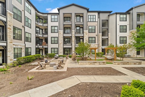 A large apartment complex with a courtyard in the middle.