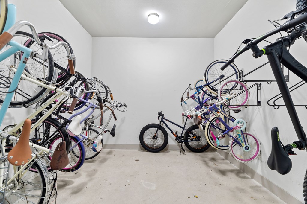 A room full of bicycles of various types and sizes.