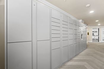 A row of white lockers in a room.