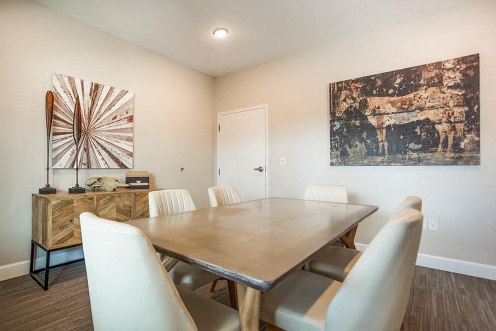 a dining room with a table and chairs