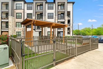 A building with a brown wooden structure in front of it.
