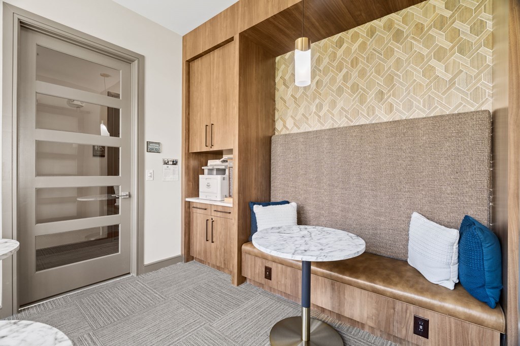 A small room with a table and a bench.