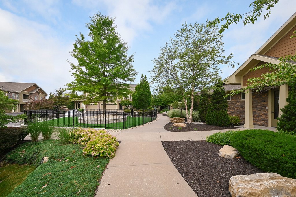 the preserve at ballantyne commons community walkway with trees and buildings