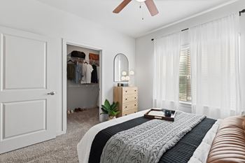 a bedroom with a bed and a closet