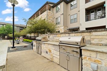 A stone wall with a mailbox and a mailbox on top of it.