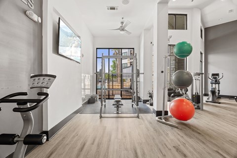 A spacious gym with a variety of exercise equipment.