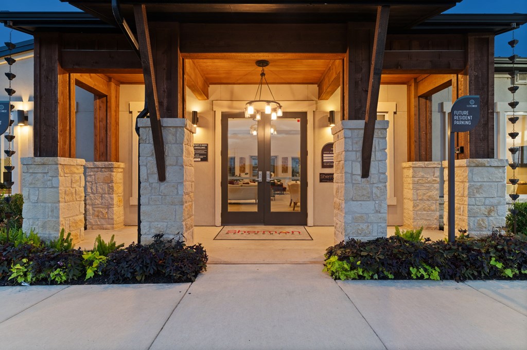 The front of a building with a stone pillar and a sign that says "RETAIL".