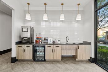 A modern kitchen with wooden cabinets and a black countertop.