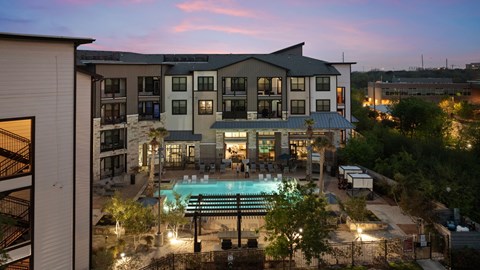 A large building with a pool in the middle of it.