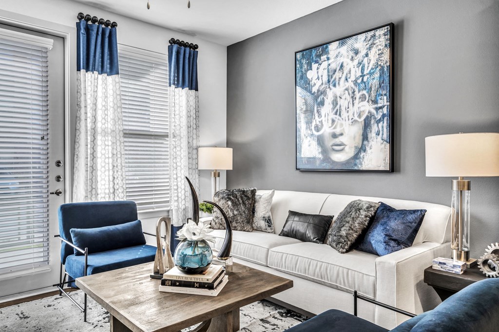 a living room with a white couch and a table