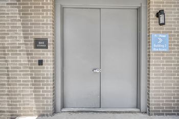 a metal door with a sign that says bike storage