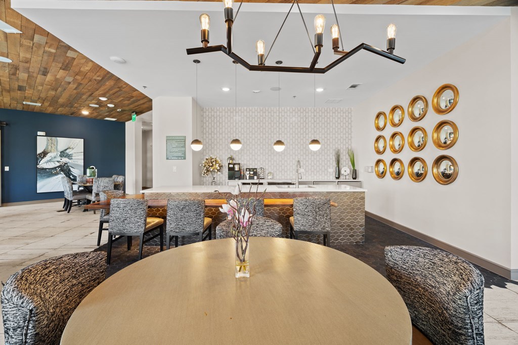 A dining room with a wooden table and chairs.