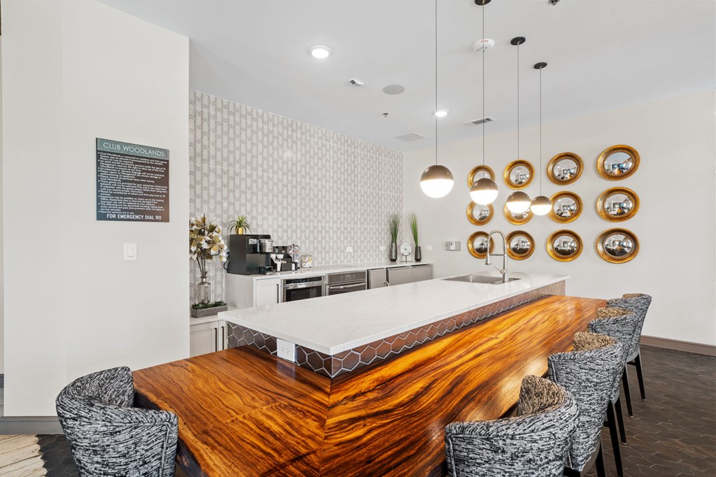 A modern dining room with a wooden table and chairs.