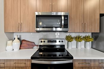 a kitchen with a stove and a microwave