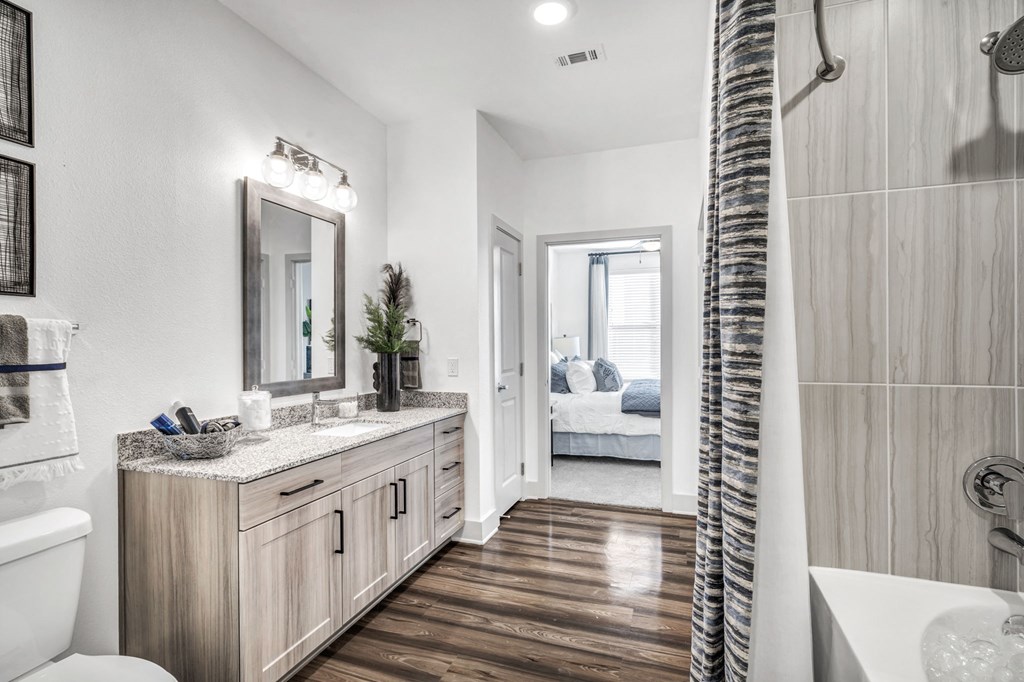 a bathroom with a shower and a sink