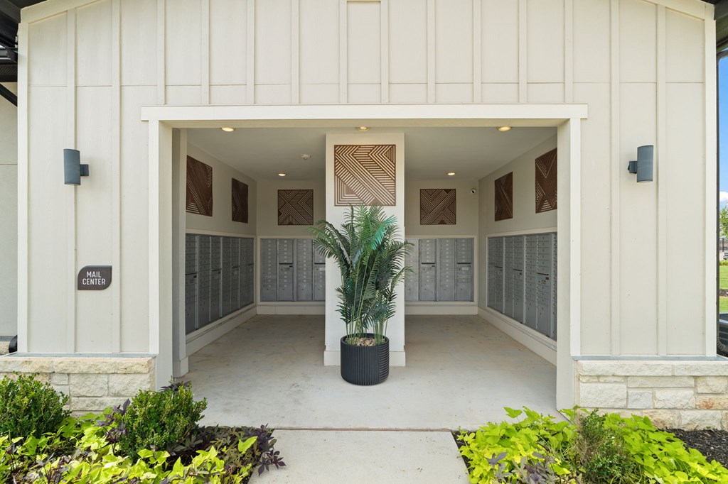 A white building with a sign that says "Main Center" on the door.