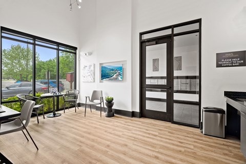 A room with a wooden floor and a glass door.