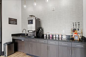 A coffee shop with a counter and a coffee machine.