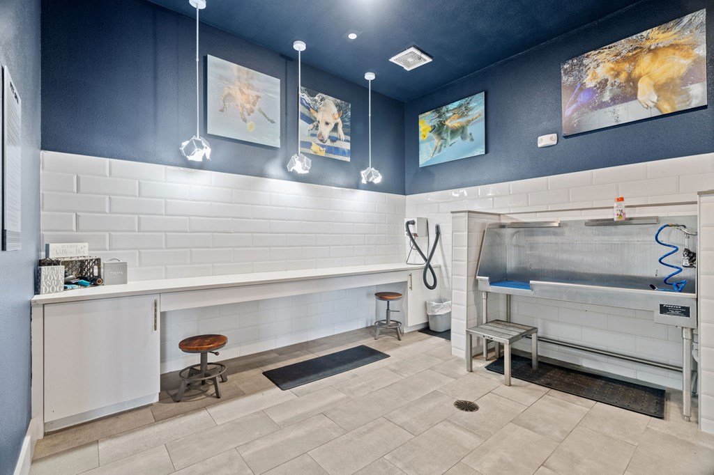 A modern kitchen with a white counter and a sink.