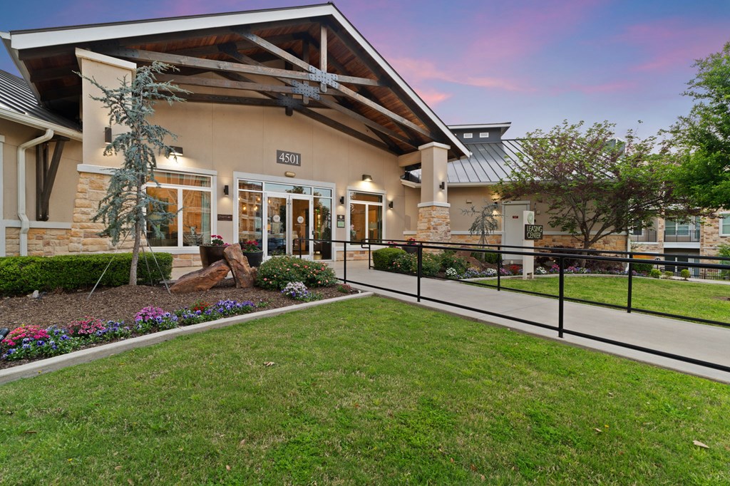 A house numbered 4501 with a front yard and a fence.