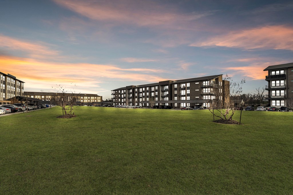 a view of the apartments from the parking lot