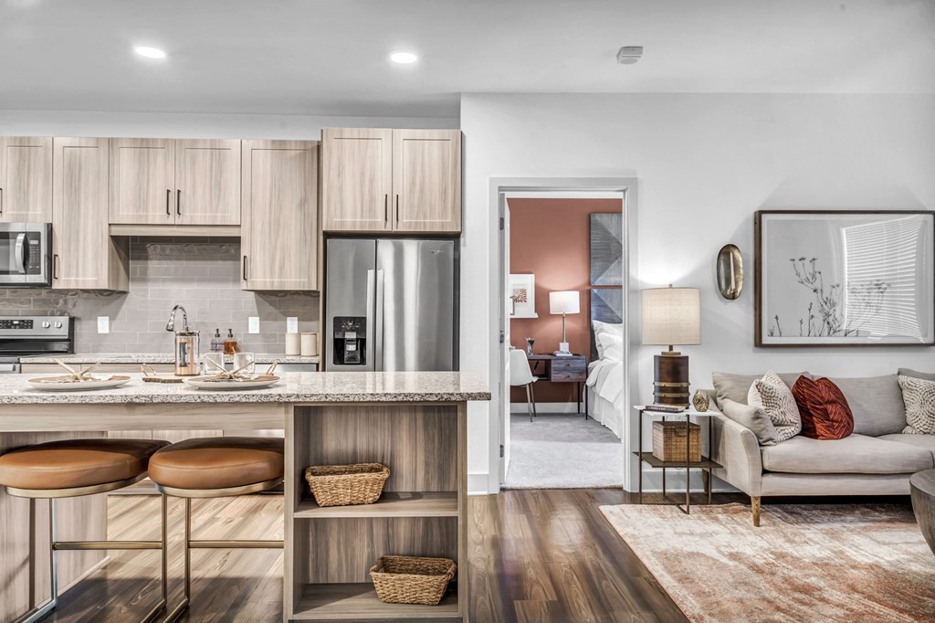 a living room with a kitchen and a couch