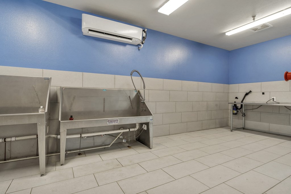 a kitchen with a sink and a counter in a room