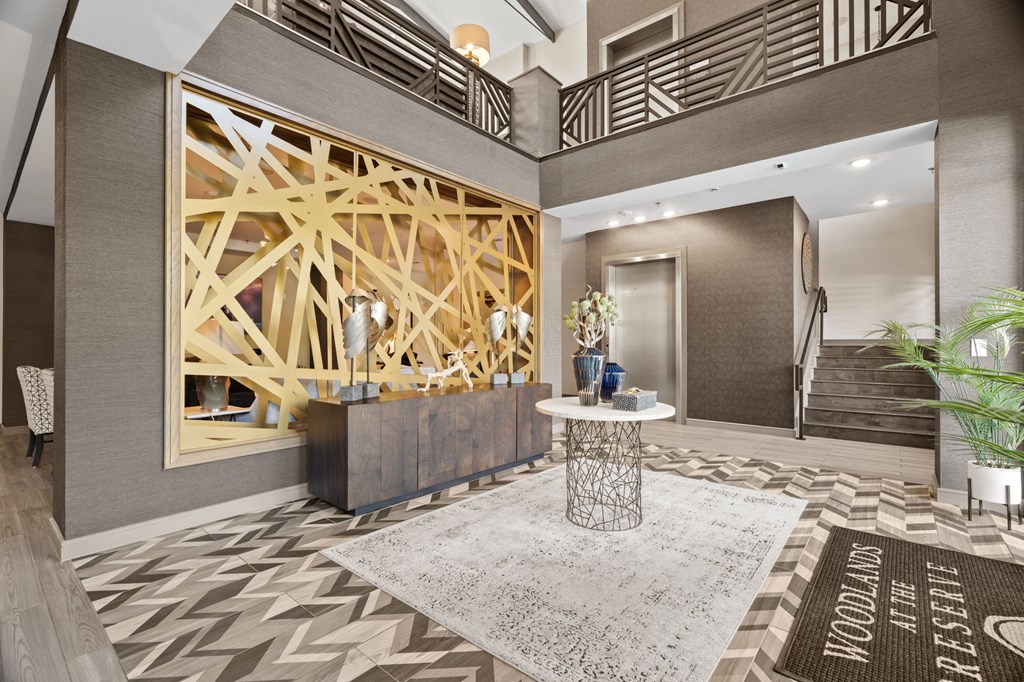 A large wooden structure is in the middle of a room with a table and chairs.