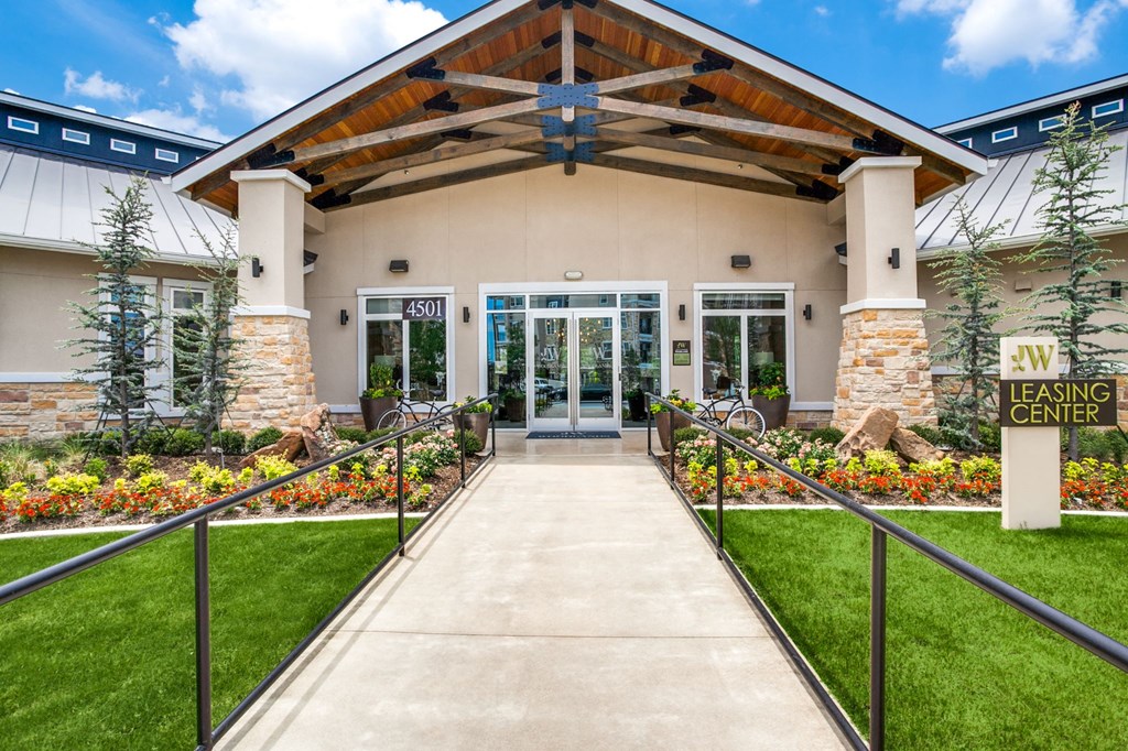the entrance to the leasing center of an leasing center building