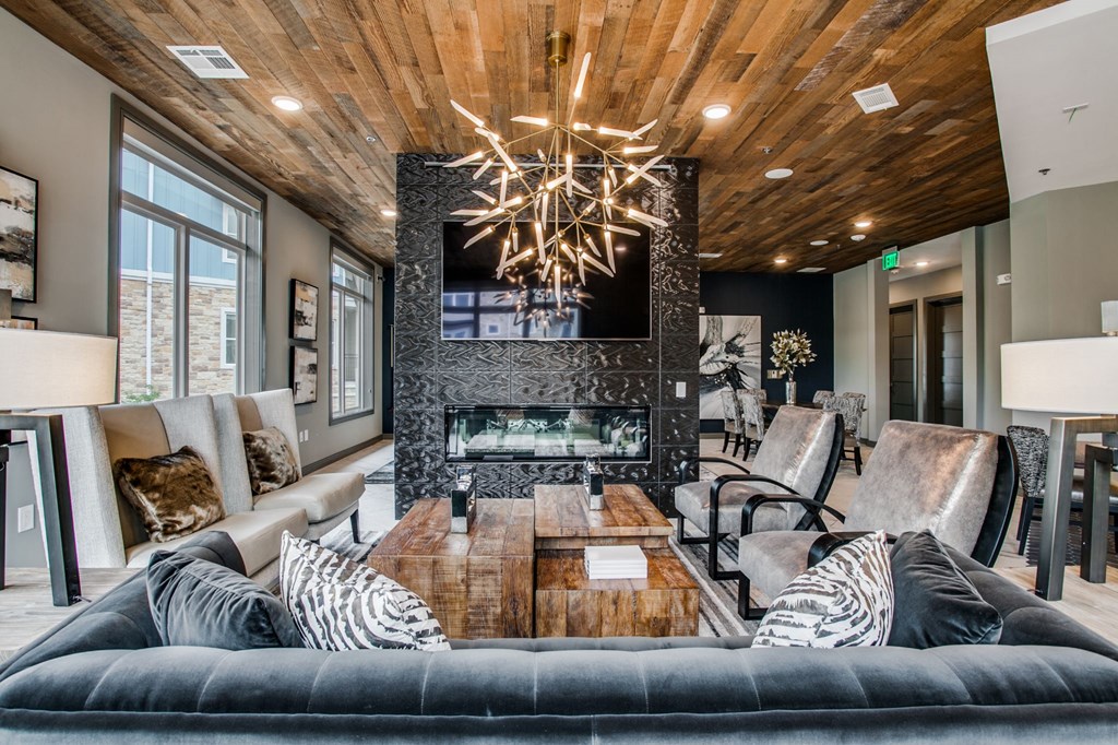 a living room with a couch and a table and a fireplace
