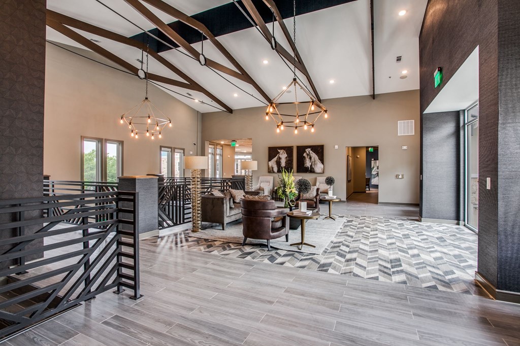 the lobby of a building with a lobby area and a staircase