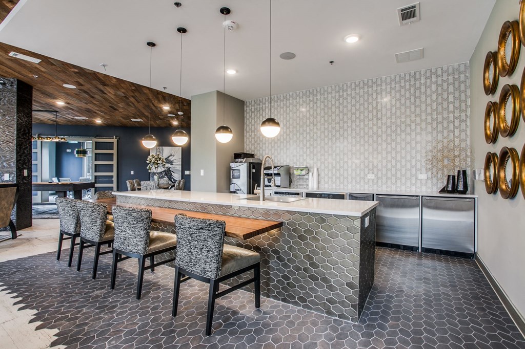 a large kitchen with a large island and chairs