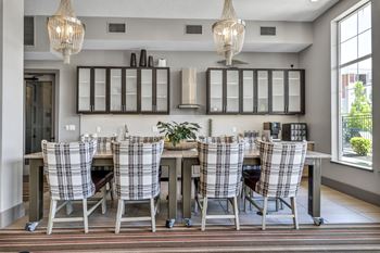 Large dining table and catering kitchen in resident lounge