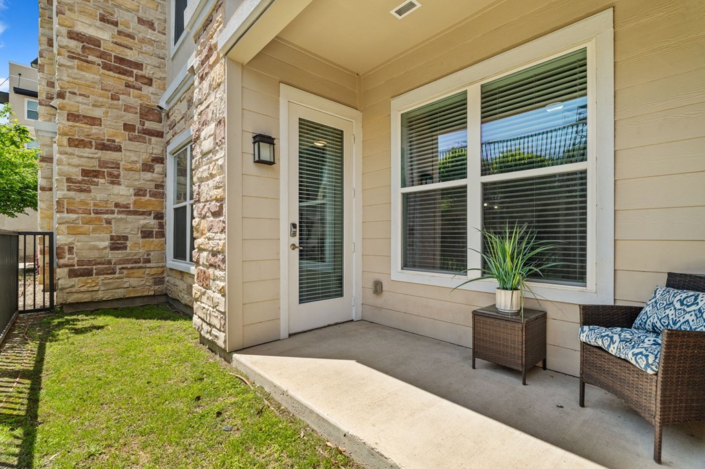 A house with a patio and a chair.