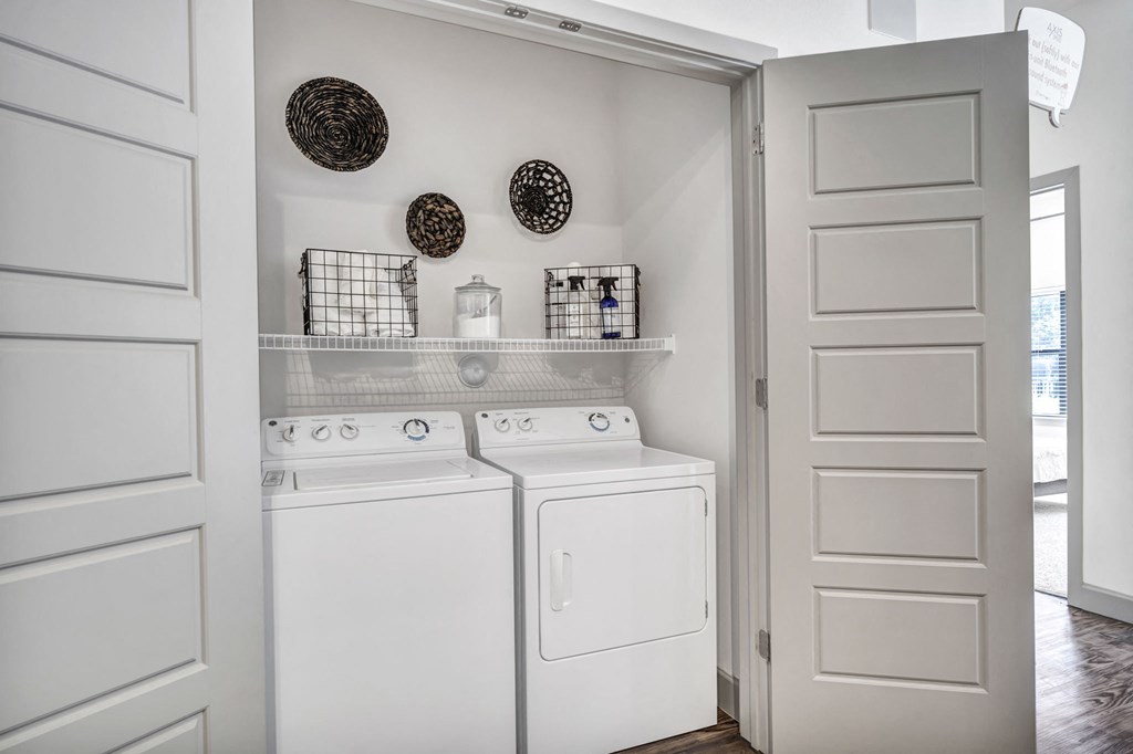 a small laundry room with a washer and dryer