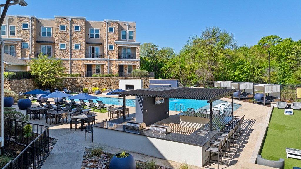 A large building with a pool and patio area.