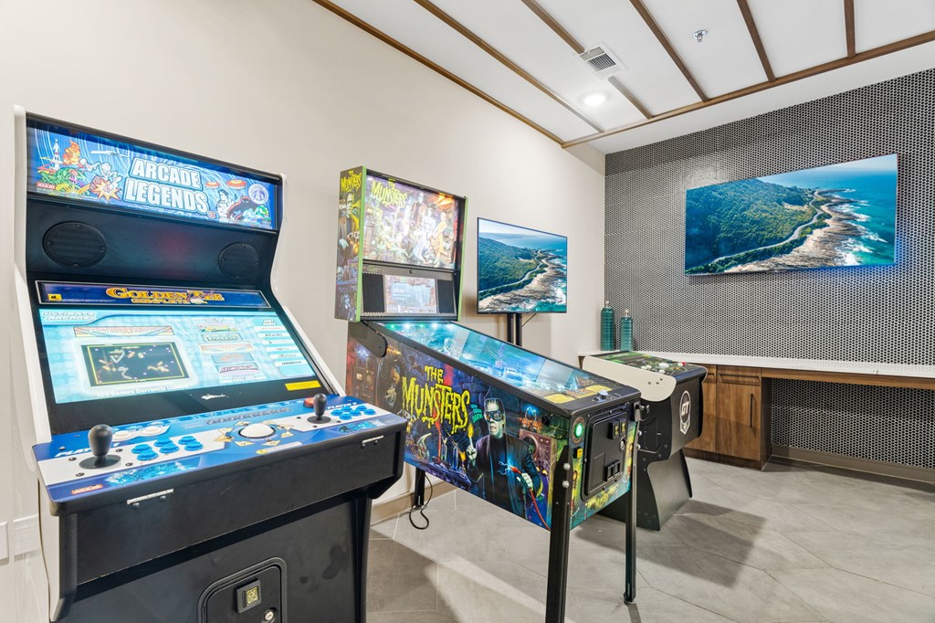 A room with two pinball machines, one of which is Monsters.