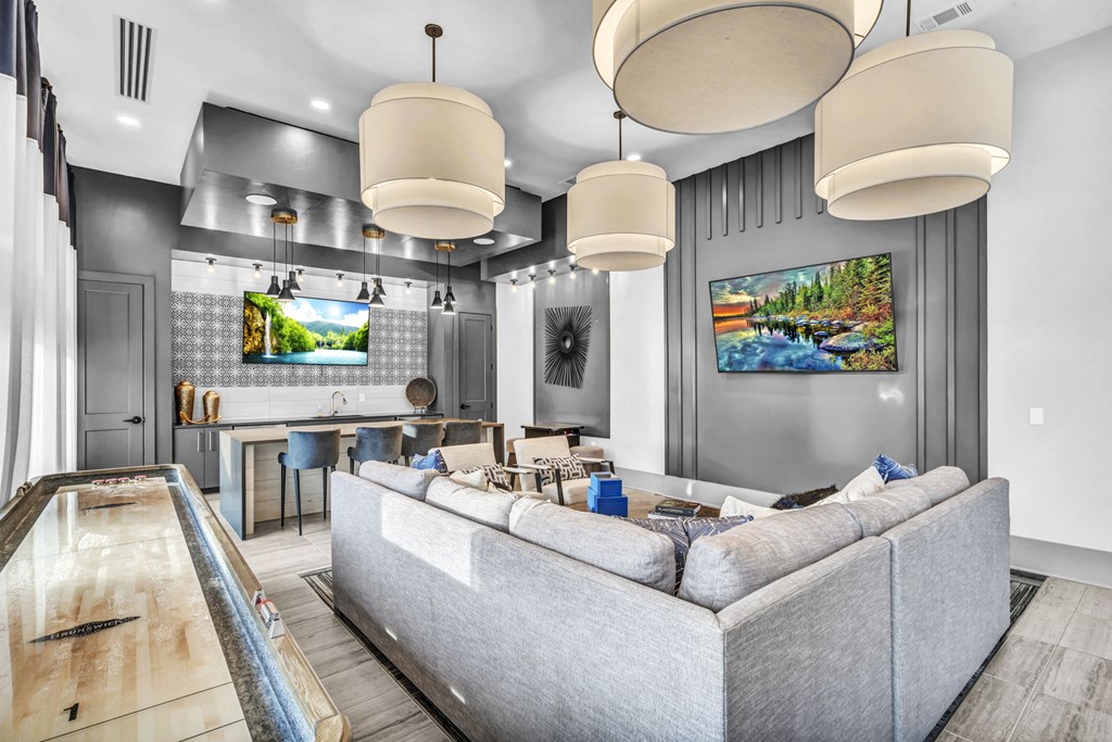 a living room with a couch and a bar