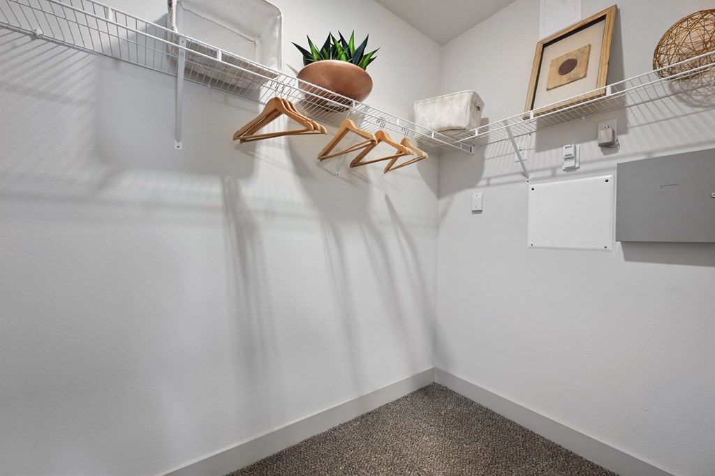 our spacious laundry room is equipped with a washer and dryer