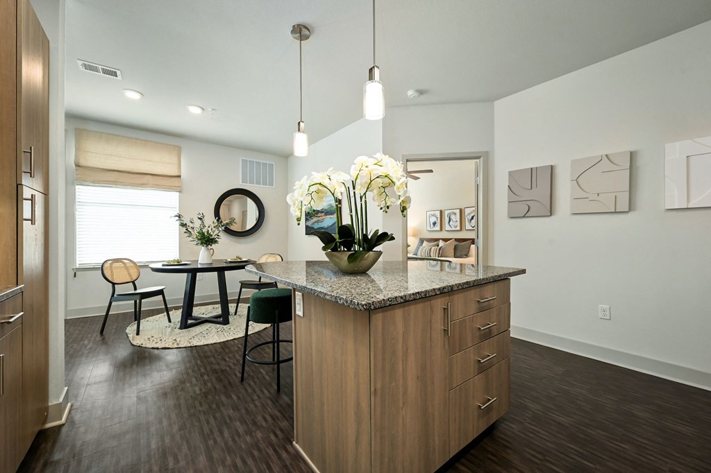 an open kitchen and dining room with a table and chairs