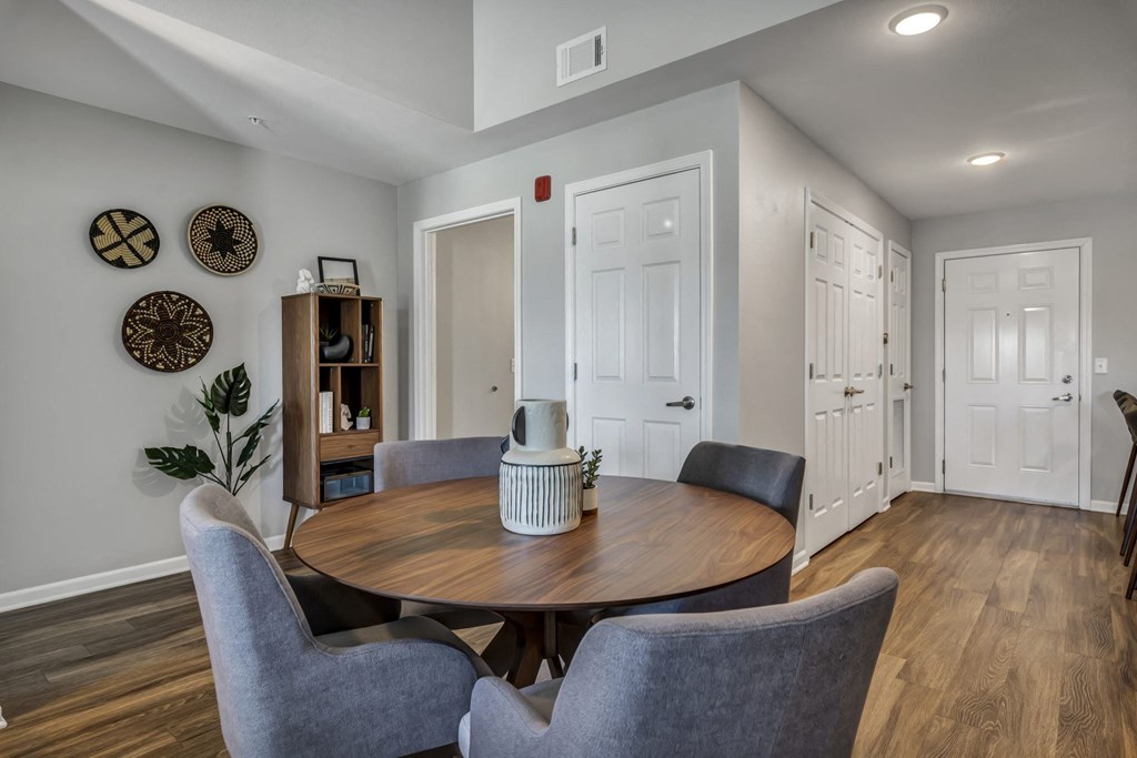 a dining room with a table and chairs