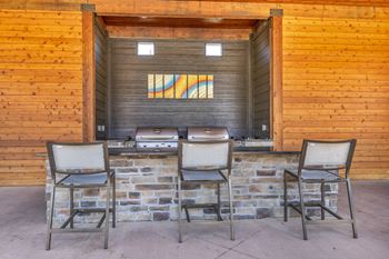 Grills behind pool¦Kansas City Luxury Apartments