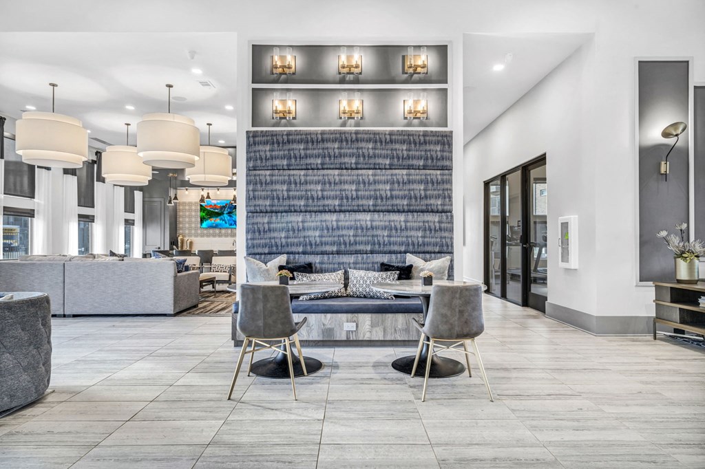 a living room with a table and chairs
