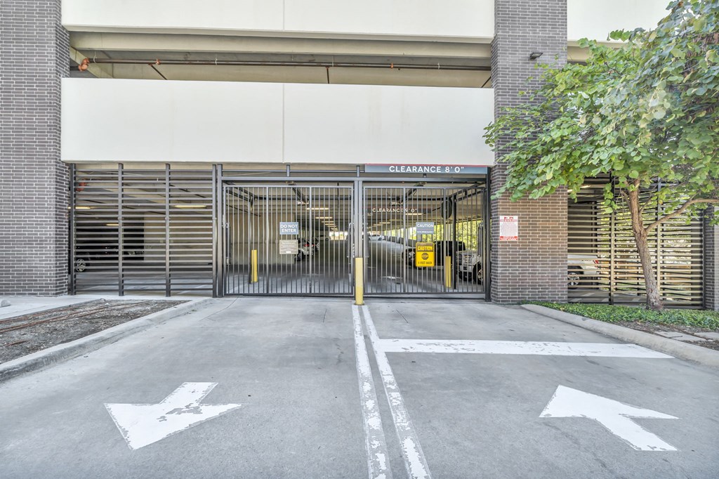 a large garage door is open in front of a brick building