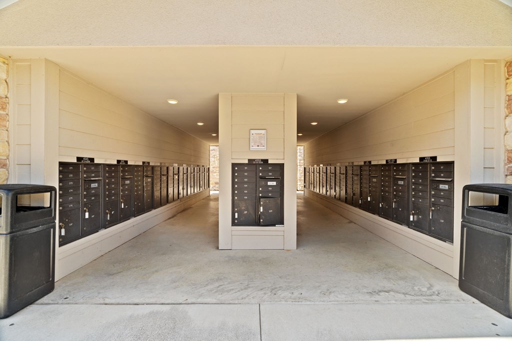 A long hallway with a row of lockers on each side.