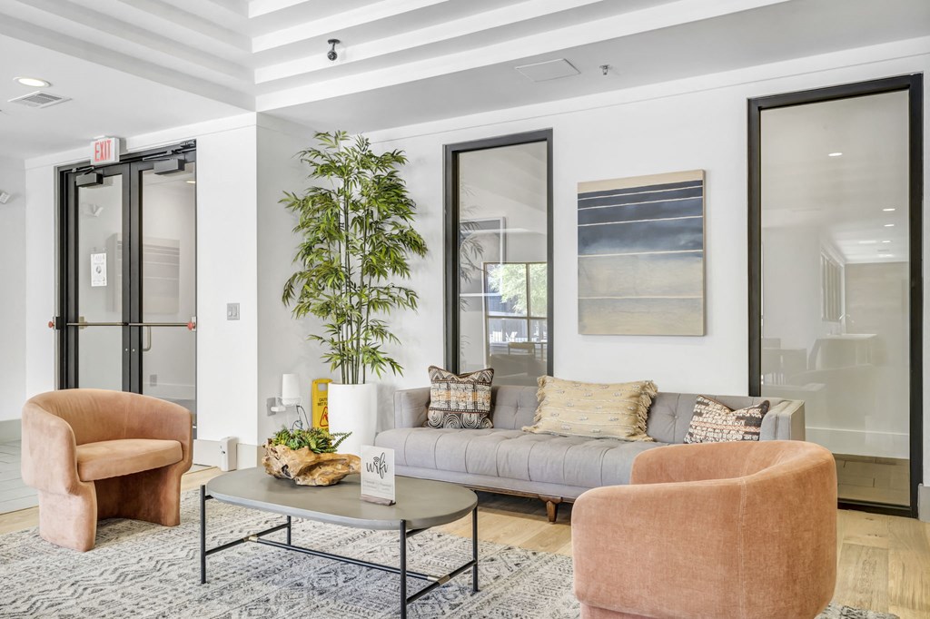 a living room with a couch coffee table and two chairs