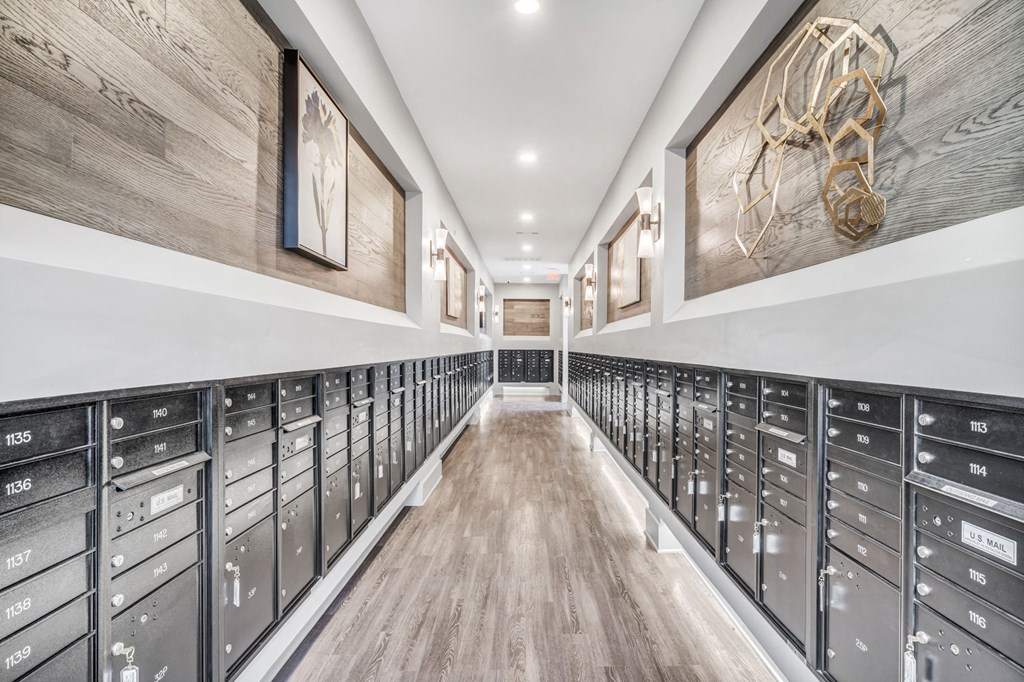 a long room with a bunch of mailboxes in it